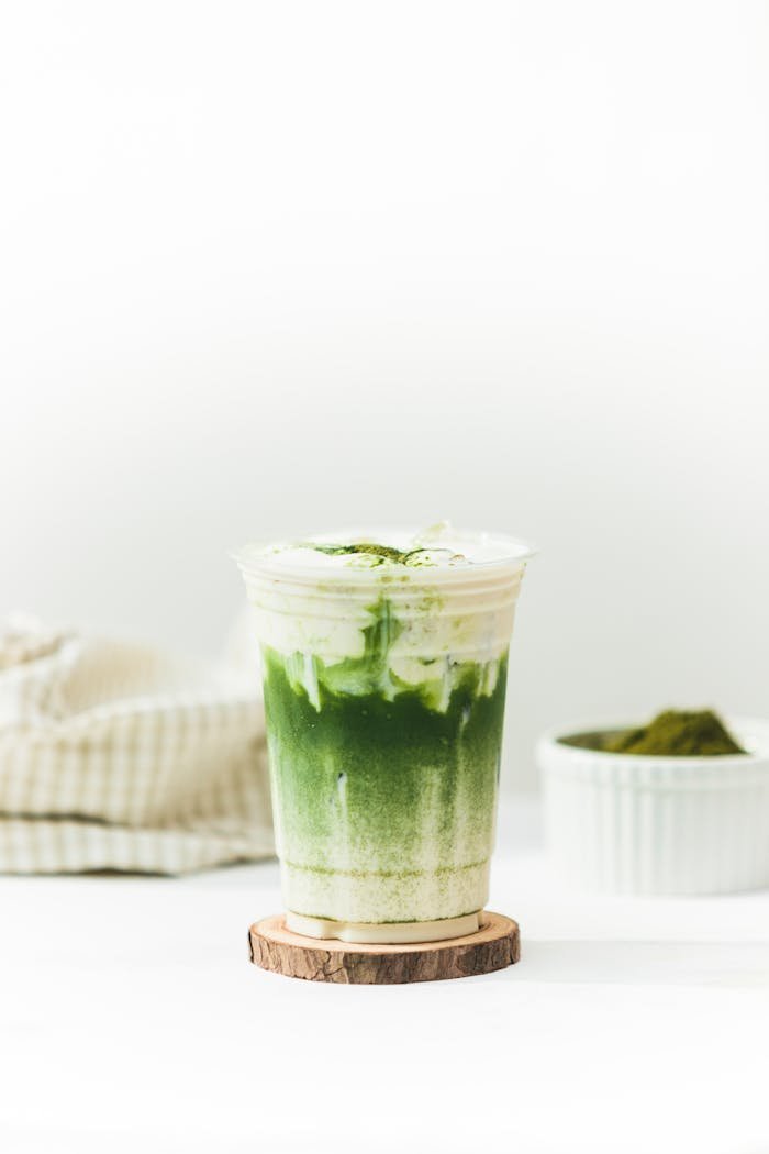 White and Green Drink in a Cup